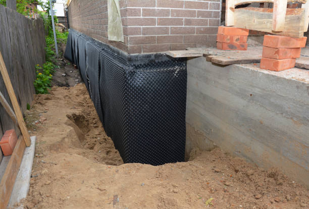 SJ Waterproofing Pros technician performing targeted Exterior Waterproofing assessment in South Bend, IN